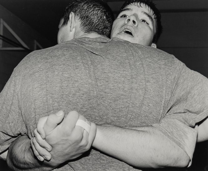 This is a photograph of two men embracing.