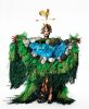 This is a photograph of a person in an elaborate costume standing in front of a white paper backdrop.