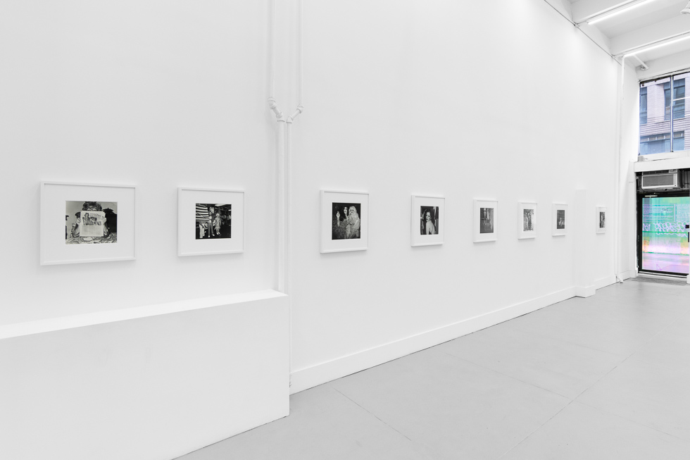 This is an installation view of a gallery space with photographs on display.