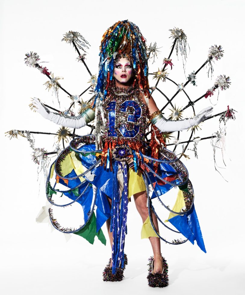 This is a full-length photograph of a person wearing an elaborate costume.