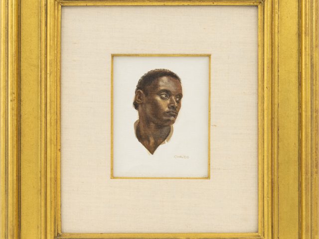 This is a small painting of a black man in a golden frame.