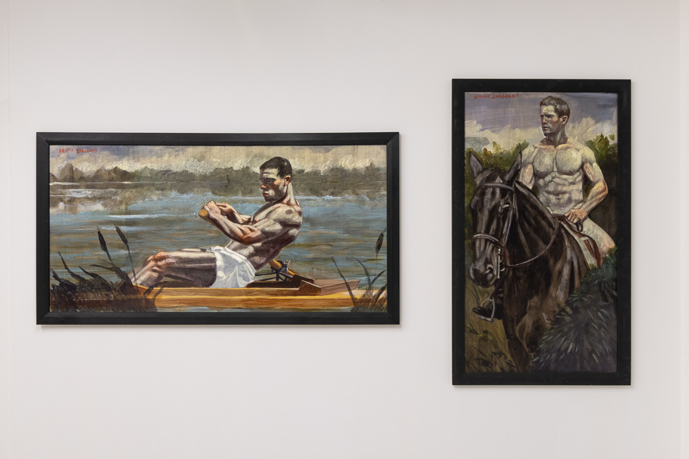 This is a photograph of oil paintings in a gallery setting.