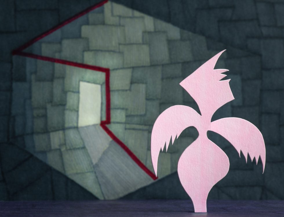 An abstract artwork featuring a stylized, bird-like figure in light pink against a complex geometric background. The figure has sharp, angular wings and a pointed head. The background is composed of overlapping, irregular shapes in muted tones of green and grey, with a distorted hexagon or cube outlined in red at the center. The overall composition creates a sense of depth and contrast between the delicate figure and the intricate background.