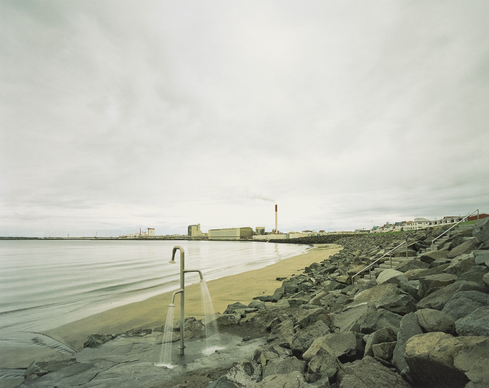 This is a color photograph of an empty desolate beach.