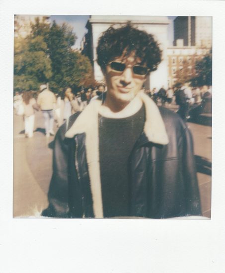 Click for sizes / editions / prices. A polaroid of a handsome young man with a leather jacket, curly hair, and sunglasses.