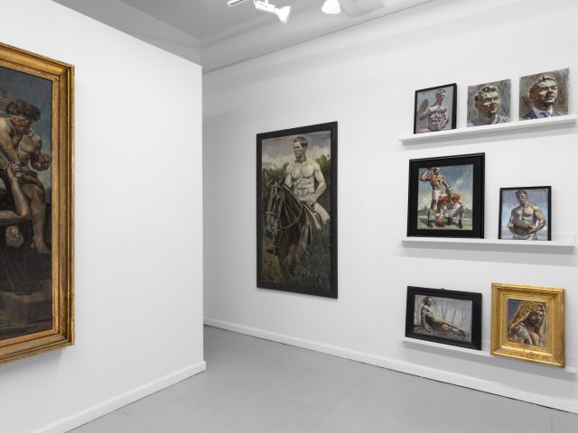 An installation view of a painting showroom with white walls and classical figurative oil paintings on display.