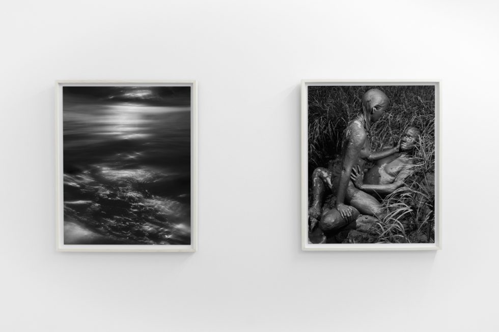 An installation view in a bright, white-walled contemporary art gallery.