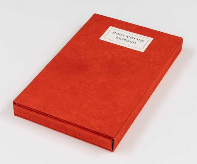 A red book sits on a white background.