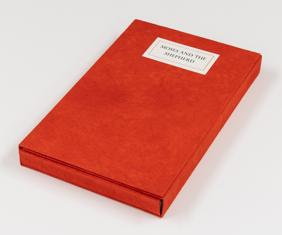 A red book sits on a white background.