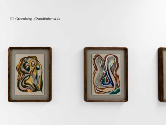 A series of abstract framed drawings hang on a white gallery wall under a black and white artist name and exhibition title.