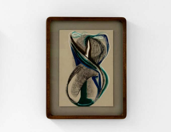 A series of abstract framed drawings hang on a white gallery wall under a black and white artist name and exhibition title.