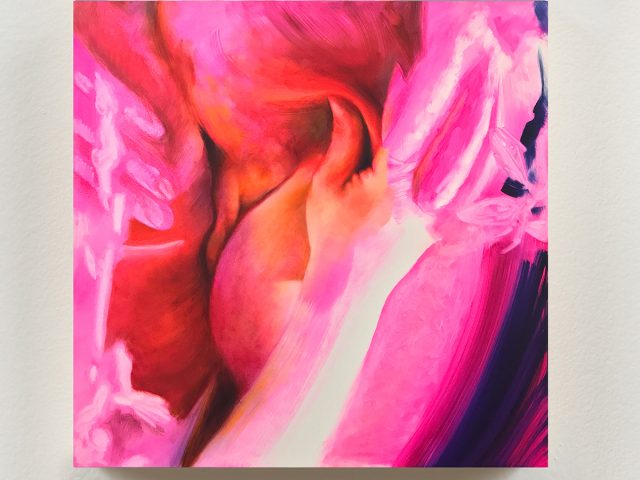 An abstracted painting in hot pink and red of two human figures.