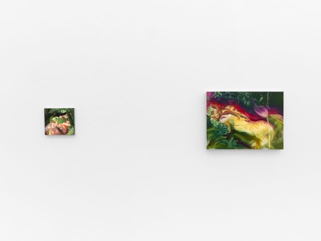Two colorful paintings depict figures and flowers in lush, dreamlike environments with saturated greens, yellows, and reds on a white wall.