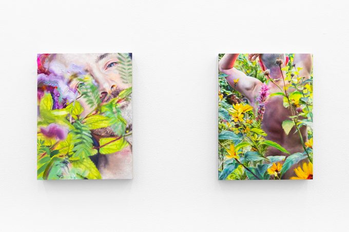 Two colorful figurative paintings against a white wall.