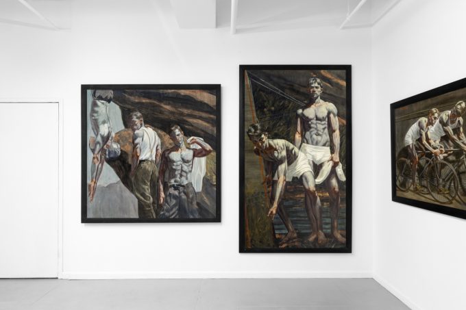 An exhibition of figurative paintings depicting male subjects in various athletic and everyday scenes.