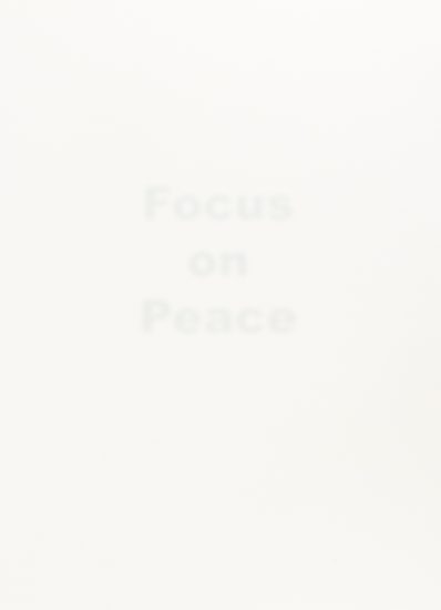 A stark white image features the faint, barely visible word "Focus on Peace" in the center, hinting at a minimalist conceptual piece.