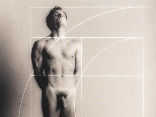 Nude man stands upright with eyes closed, overlaid by a white Fibonacci spiral and golden ratio grid on a soft gray background.