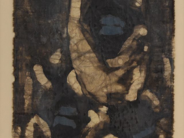An abstract blue and brown design on a piece of fabric.