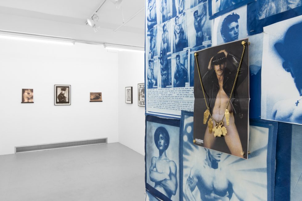 Contemporary artworks displayed along stark white bright gallery walls.
