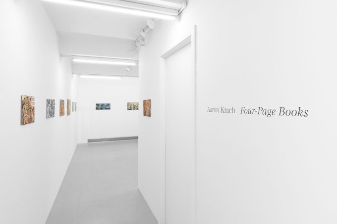 Gallery installation view showing mixed-media works on white walls.