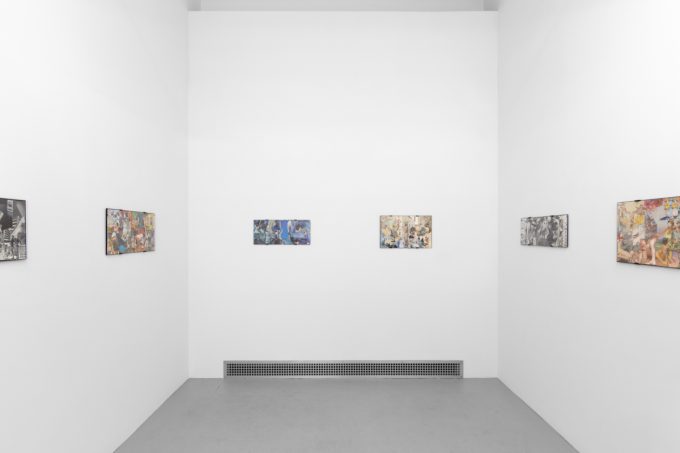 Gallery installation view showing mixed-media works on white walls.