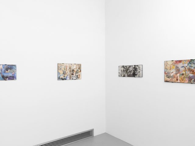 Gallery installation view showing mixed-media works on white walls.