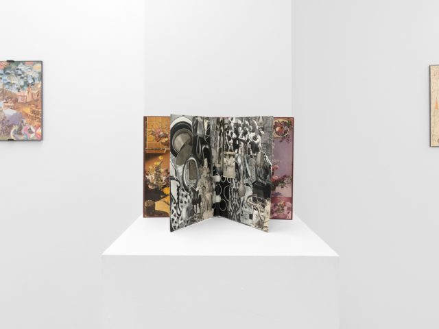 Gallery installation view showing mixed-media works on white walls.