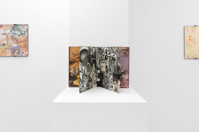 Gallery installation view showing mixed-media works on white walls.