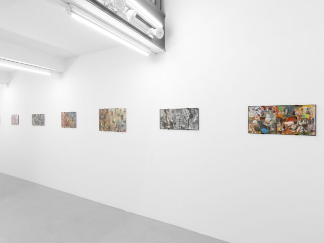 Gallery installation view showing mixed-media works on white walls.