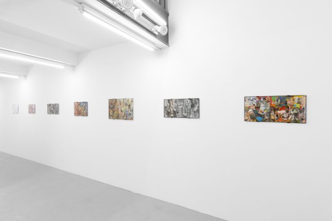 Gallery installation view showing mixed-media works on white walls.