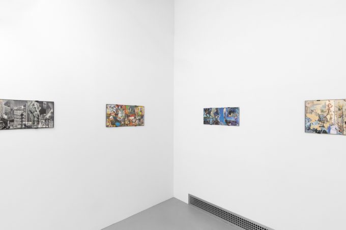 Gallery installation view showing mixed-media works on white walls.