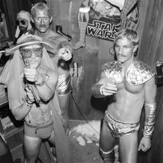 A black and white photograph of men dressed up for a Star Wars Party.