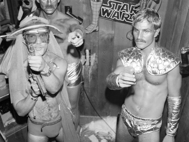 A black and white photograph of men dressed up for a Star Wars Party.