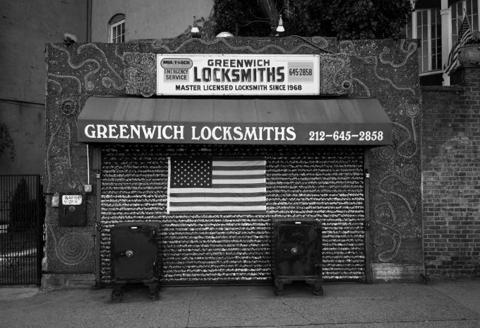 A black and white photograph of a locksmith storefront.