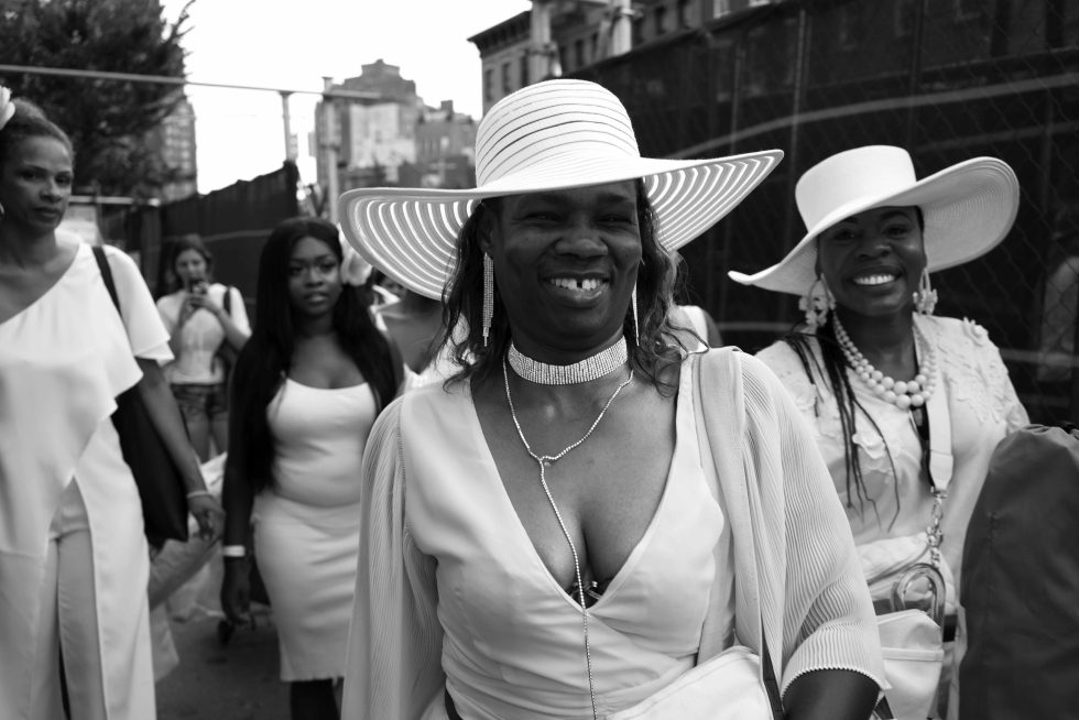 A black and white photograph of joyous women celebrating.