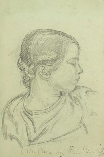 A pencil drawing of a young girl in profile on green paper.