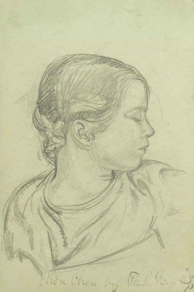 A pencil drawing of a young girl in profile on green paper.