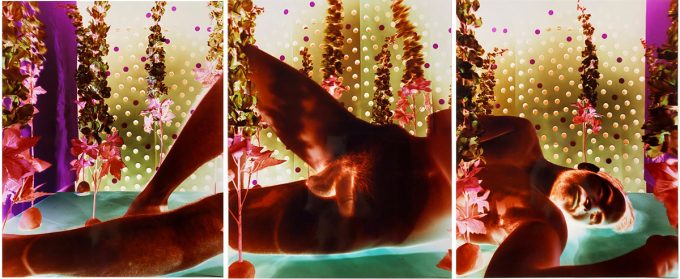 A three panel image of a nude man laying on his side, rendered in intense inverted colors.