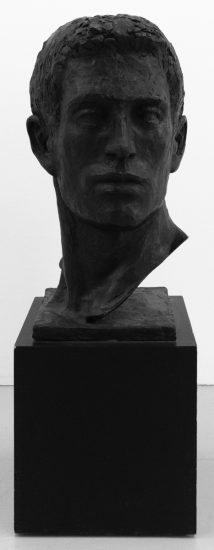A bronze bust of a man's head.