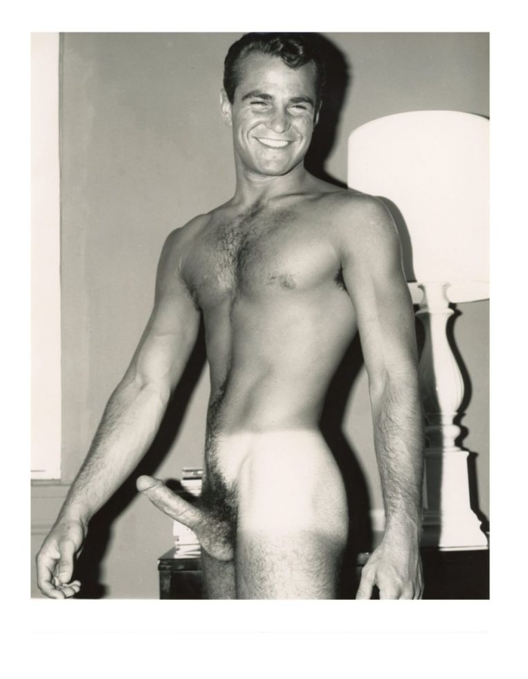 A black and white photograph of a nude model.