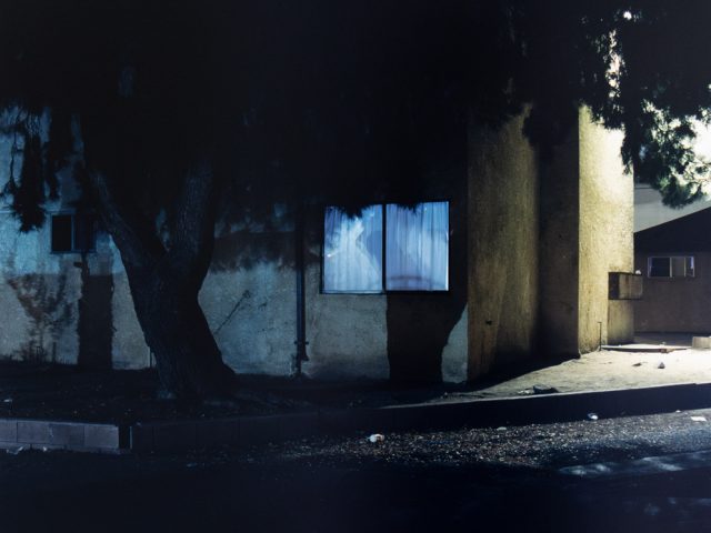 A photograph of a house at night.