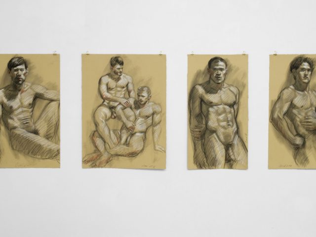 An installation photograph of various figurative artworks on a white gallery wall.