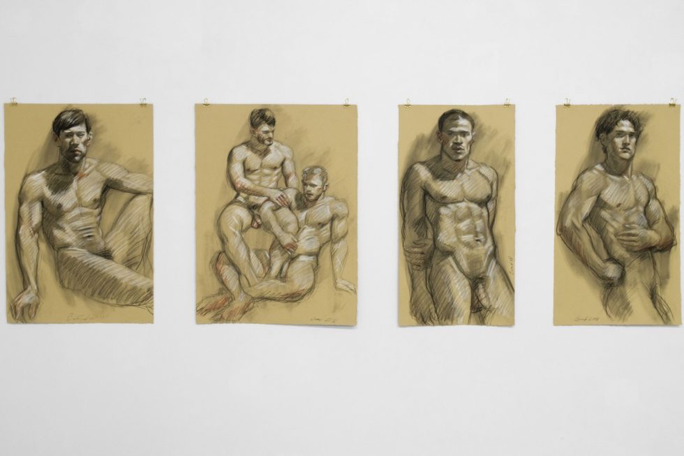 An installation photograph of various figurative artworks on a white gallery wall.