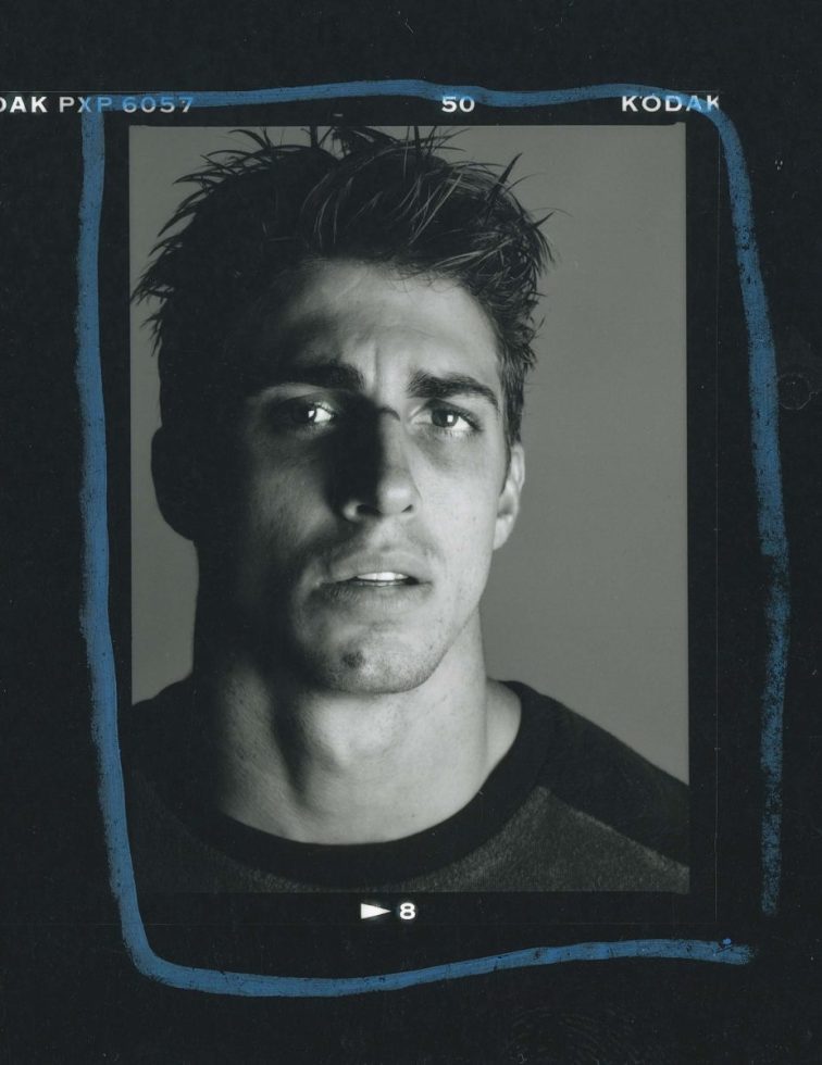 A black and white portrait of a handsome man.