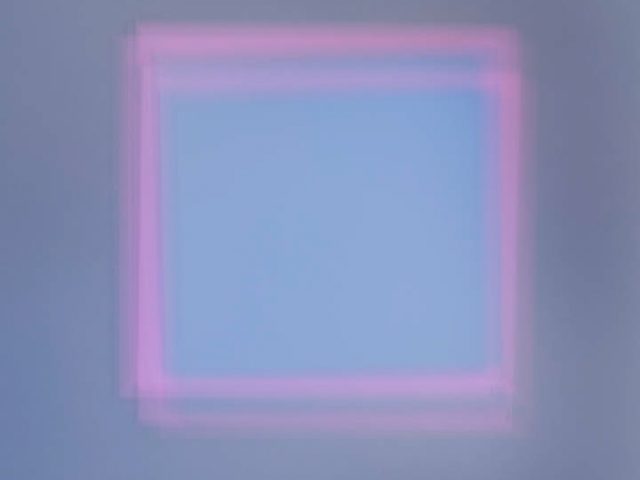 A colorful soft-focus image of various squares in many colors and hues.