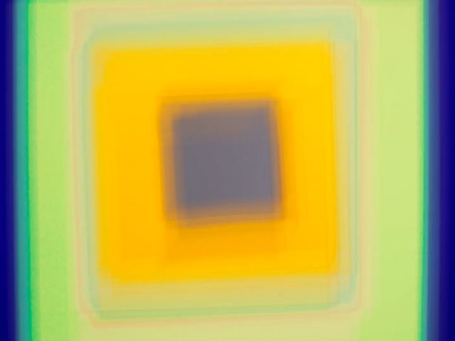 A colorful soft-focus image of various squares in many colors and hues.