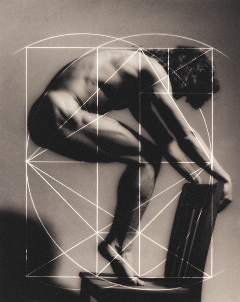 A black and white photograph of a man hunched over with lines overlayed.