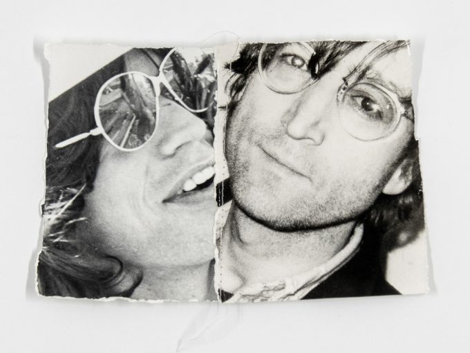 A black and white photographic collage of two rock stars.