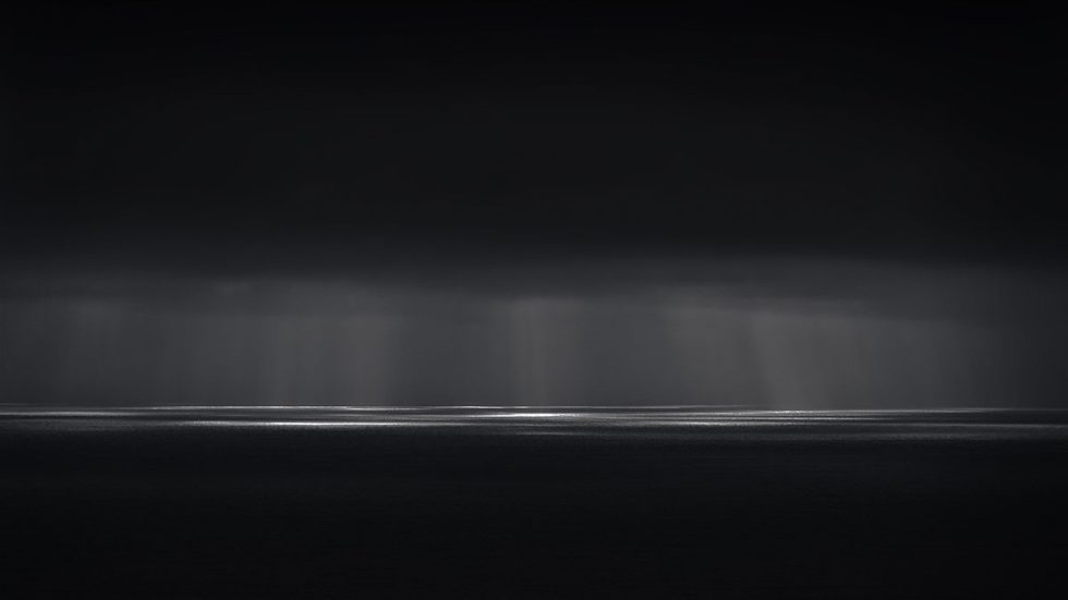 A photograph of a body of water with reflected light on the surface and a horizon line.