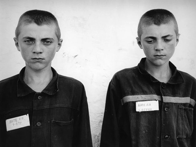 A black and white portrait of two boys.